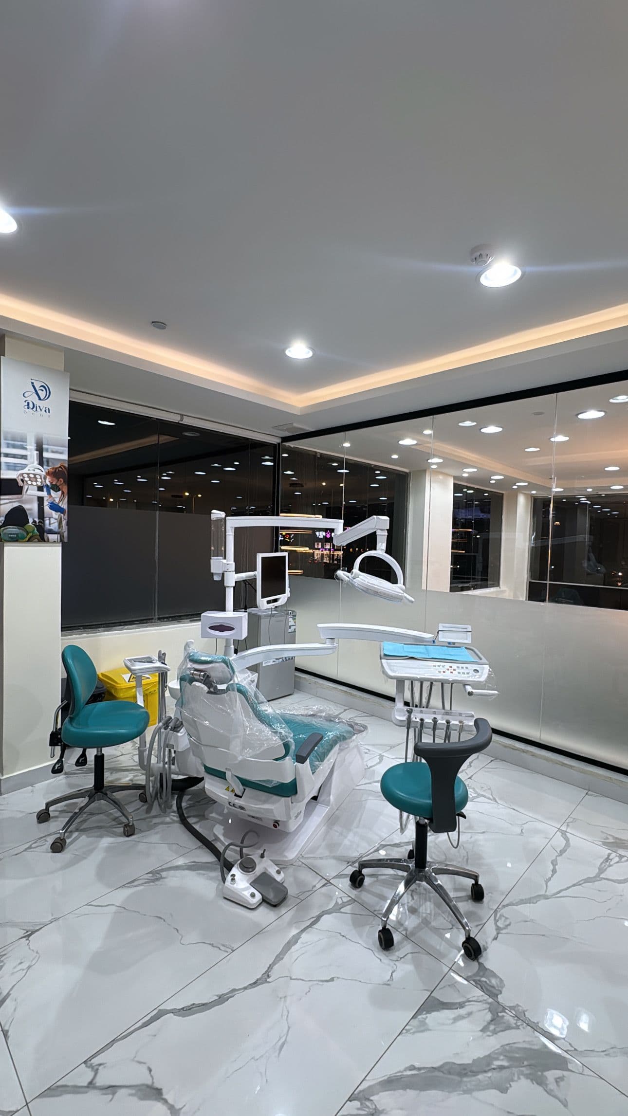 Dental workstation with modern chair and overhead light Denta at Diva