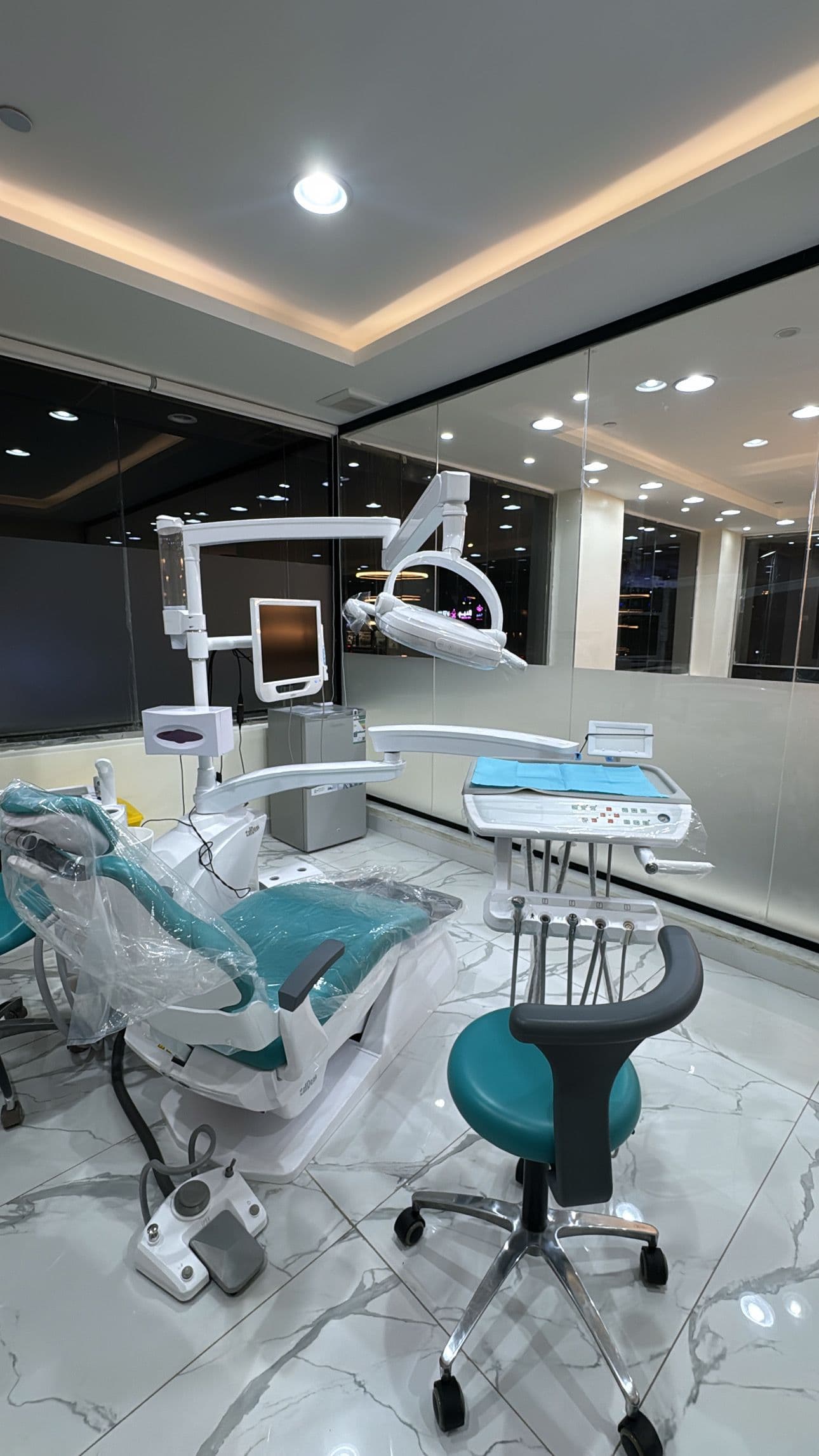 Dental workstation with modern chair and overhead light Denta at Diva