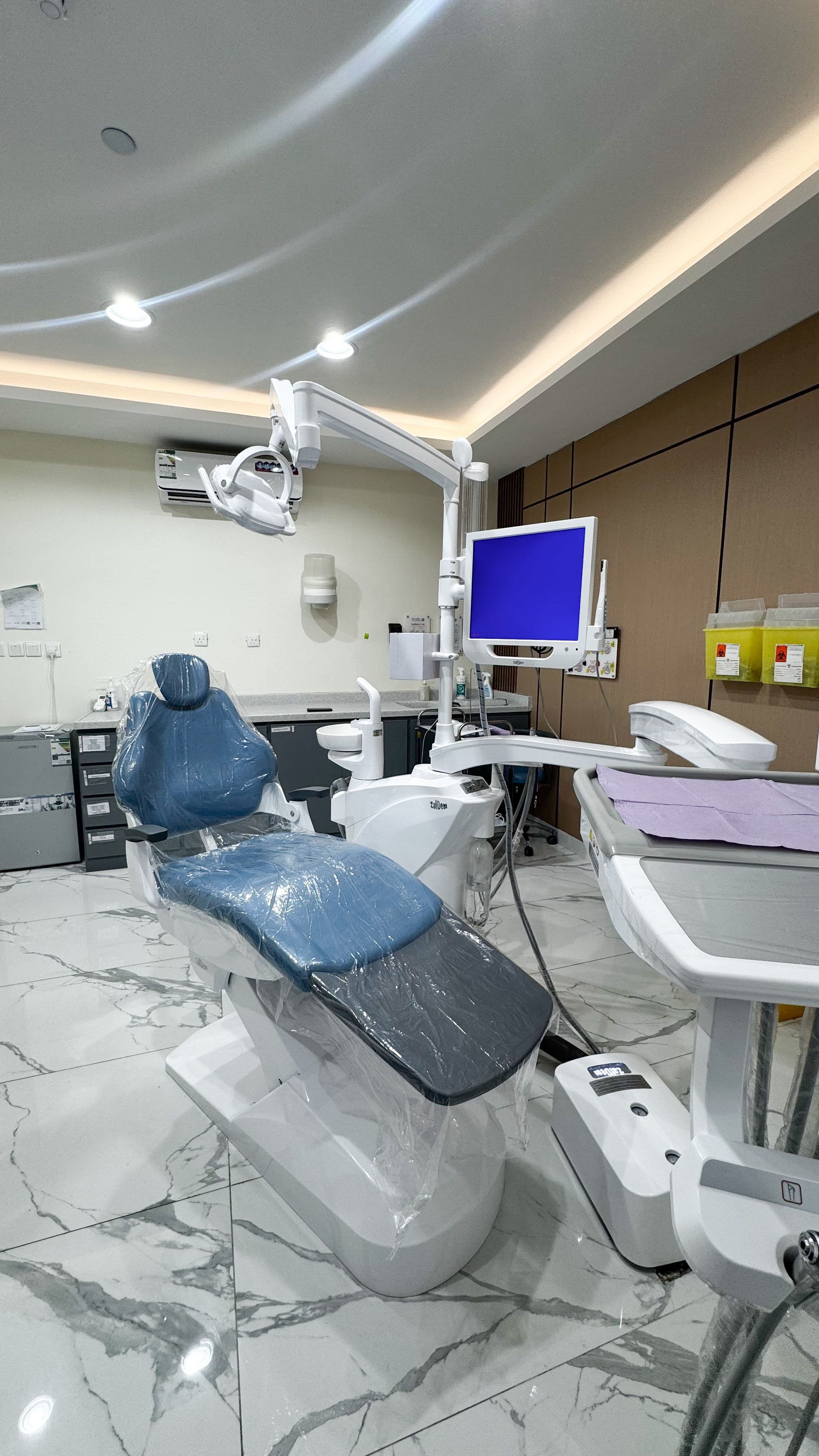 Dental workstation with modern chair and overhead light Denta at Diva