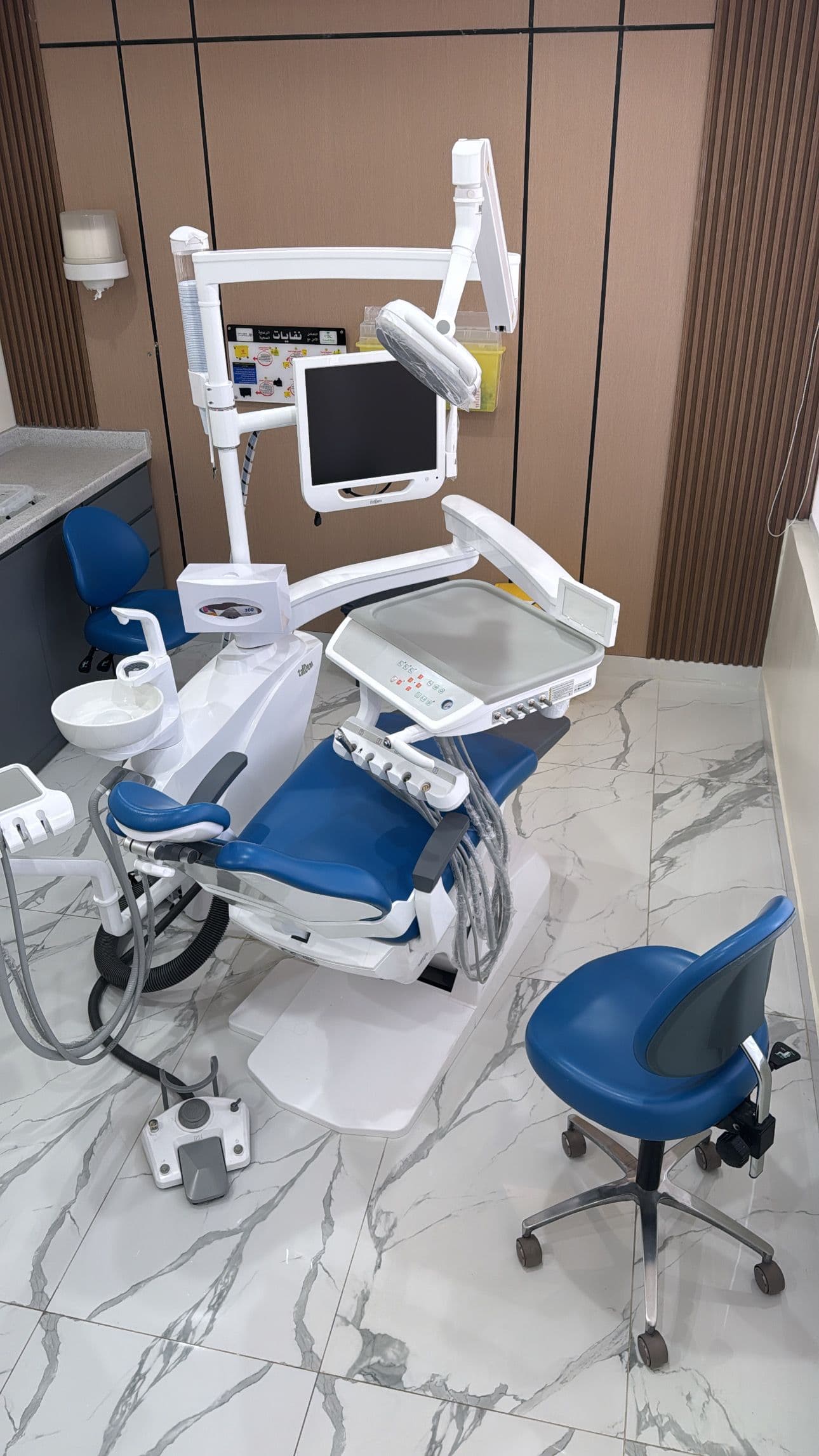 Dental workstation with modern chair and overhead light Denta at Diva